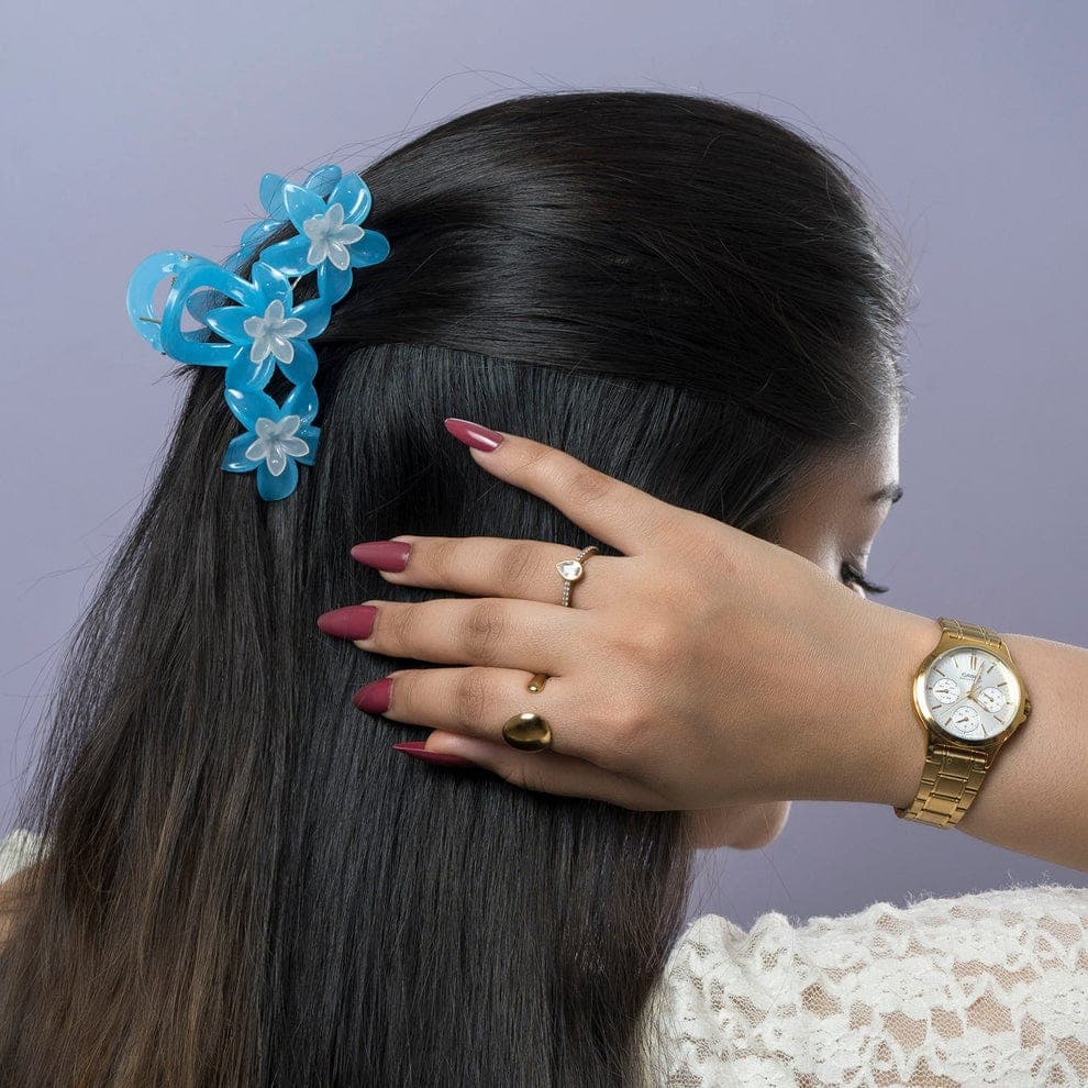 Title floral hair claw with layered flower design